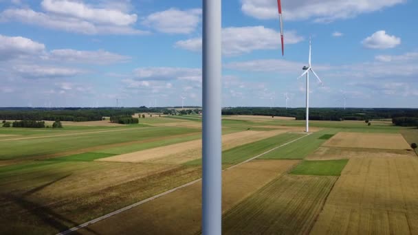 Arrays of large turbines from a drone in summer. — Stock Video