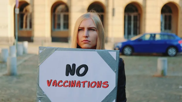 Young woman protesting against vaccination