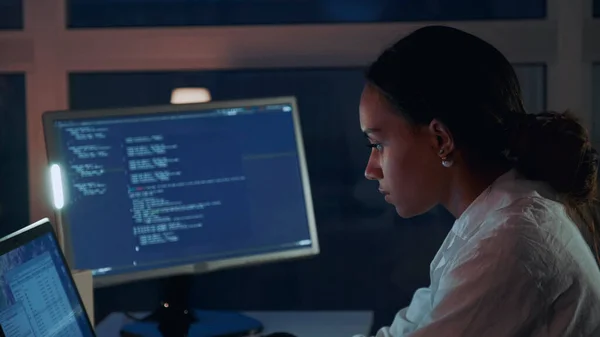 Close up of african american woman working on computer in electronics laboratory. — Stock Photo, Image