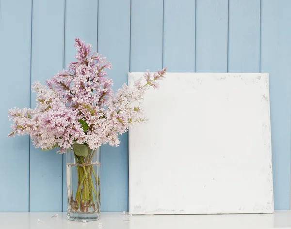 Bunch of lilac and blank canvas — Stock fotografie