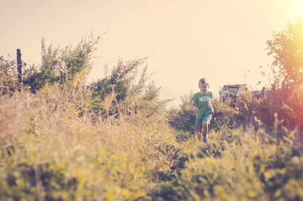 Happy smiling child running to his mom — Stock Photo, Image