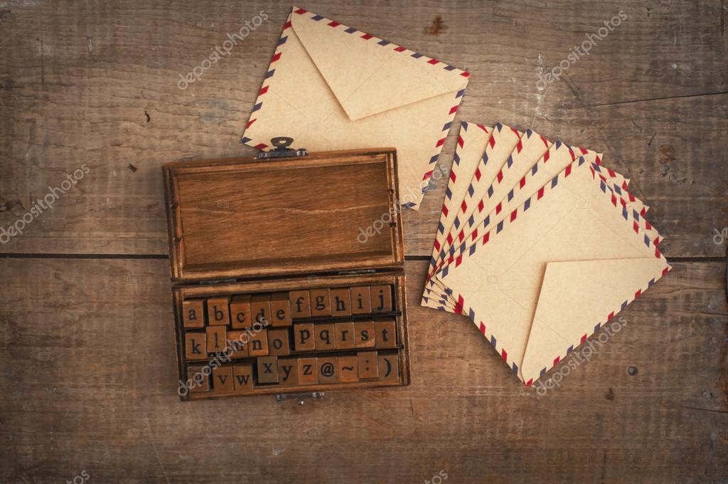 Wooden stamps alphabet and vintage envelopes Stock Photo by ©alien1855  85400766