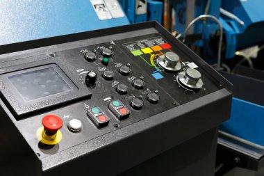 Control console with touch screen. Control console of automated metalworking equipment. Selective focus.