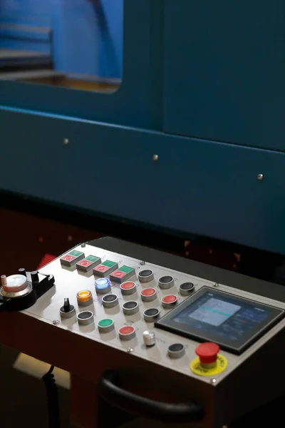 Control panel with touch screen of metalworking machine. Selective focus.