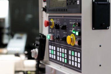 CNC control panel of modern metalworking machine. Selective focus.