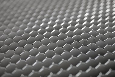 Working table of CNC laser sheet metal cutting machine. Close-up view. Industrial background. Selective focus.