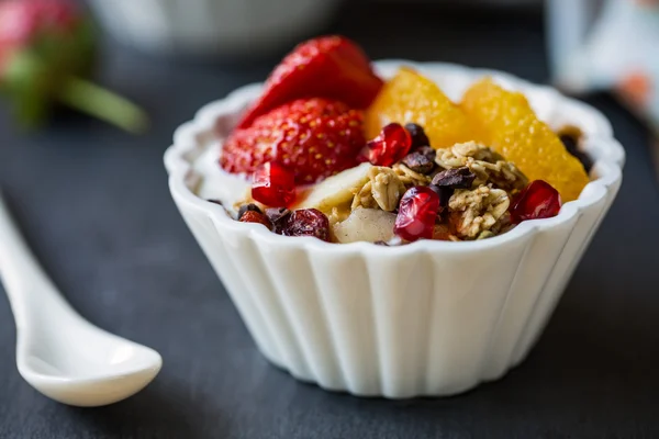 Granola with Orange , Strawberry, on yogurt — Stock Photo, Image