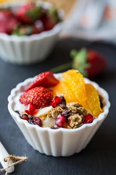 Granola with Orange , Strawberry, on yogurt — Stock Photo, Image