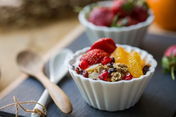 Granola with Orange, Strawberry on yogurt — Stock Photo, Image
