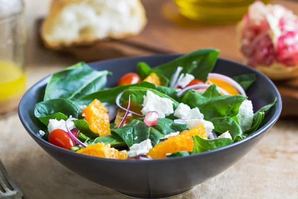 Orange with spinach, pomegranate and feta cheese salad — Stock Photo, Image