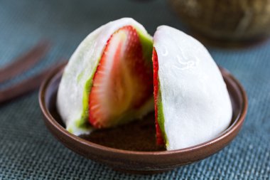 Daifuku with strawberry and green tea filling clipart
