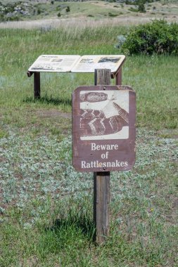 Madison Buffalo Jumping SP, MT, ABD - 2 Temmuz 2020: Yılan görme ihtimaline karşı uyarı işareti