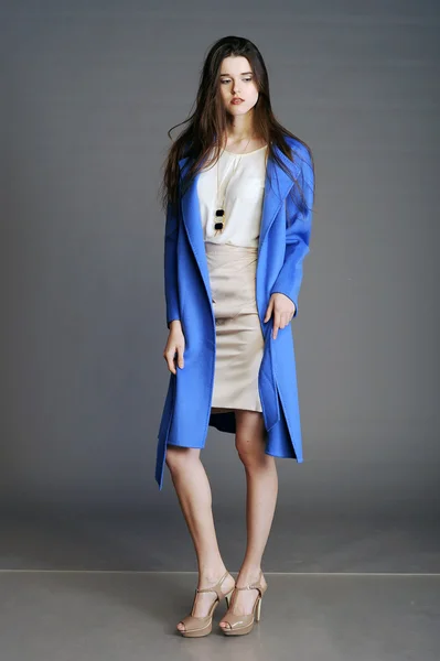 Beautiful girl  in blue coat — Stock Photo, Image