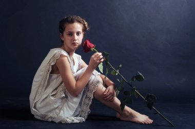 girl with a red rose, girl in a nightgown, girl in white on a black background
