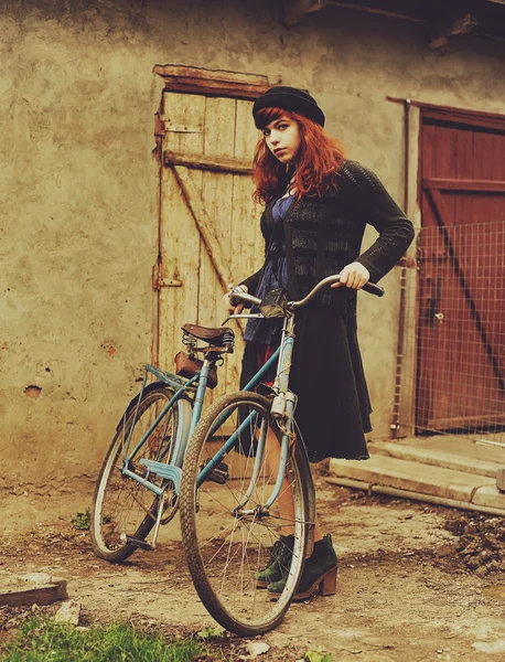 The girl by bicycle — Stock Photo, Image