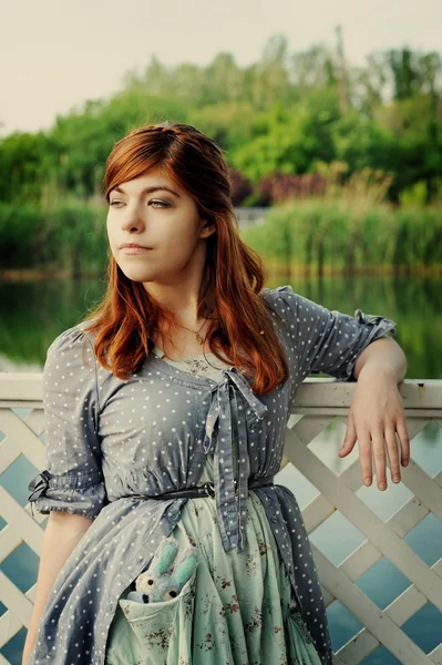 The girl at a pond — Stock Photo, Image