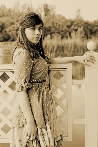 The girl at a pond — Stock Photo, Image