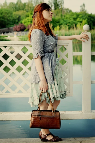 The girl at a pond — Stock Photo, Image