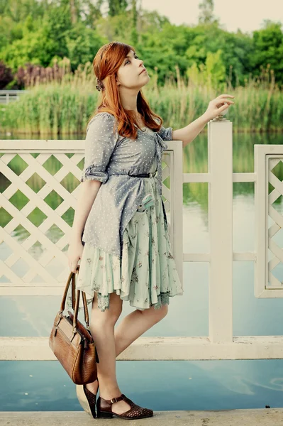 The girl at a pond — Stock Photo, Image