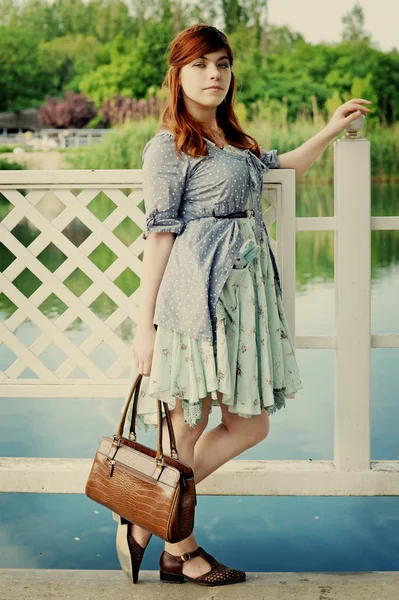 The girl at a pond — Stock Photo, Image