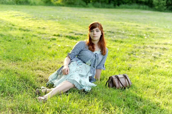 The girl on a grass — Stock Photo, Image