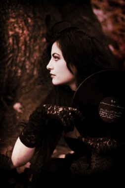 mademoiselle in Bois de Boulogne Paris, Violinist girl in little black dress,  girl with a vinyl record, sexual brunette clipart
