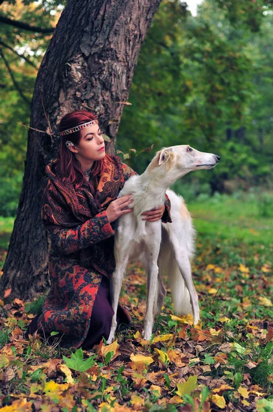 Girl with a canine borzoi dog — Stock Photo, Image