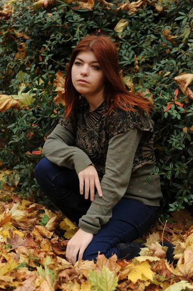 Girl with red hair in the fall — Stock Photo, Image