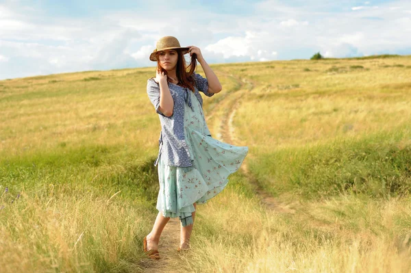 girl in a straw hat, wind in the field