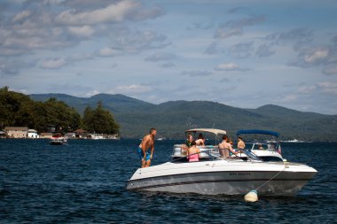 Motor boats on the Lake George clipart