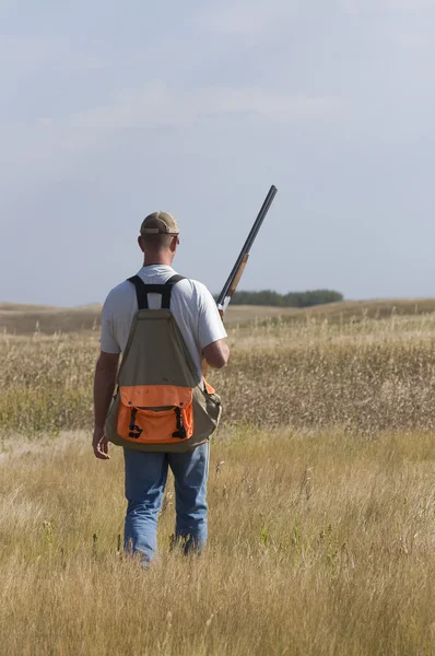 A hunter out on the prairie — Stock Photo, Image