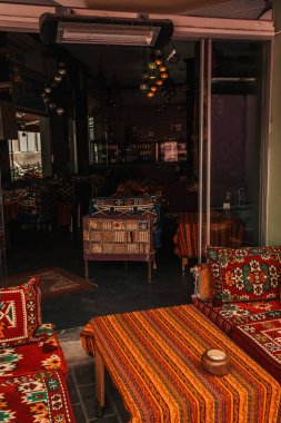 Sofas and table with oriental ornaments in outdoors cafe, Istanbul, Turkey  clipart