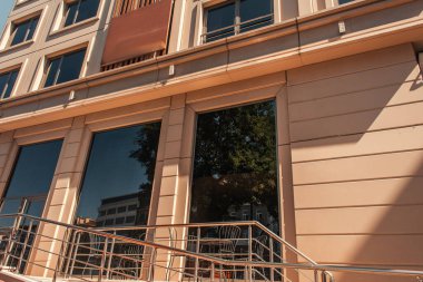 Railing near modern facade of building in Istanbul, Turkey  clipart