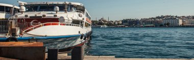 Ship with turkish flag near shore in Istanbul, Turkey, banner  clipart