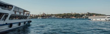 Ships on water with city at background in Istanbul, Turkey, banner  clipart