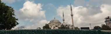 Clouds above Mihrimah Sultan Mosque in Istanbul, Turkey, banner  clipart