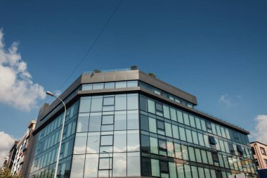 Facade of modern building with sky at background on street in Istanbul, Turkey  clipart