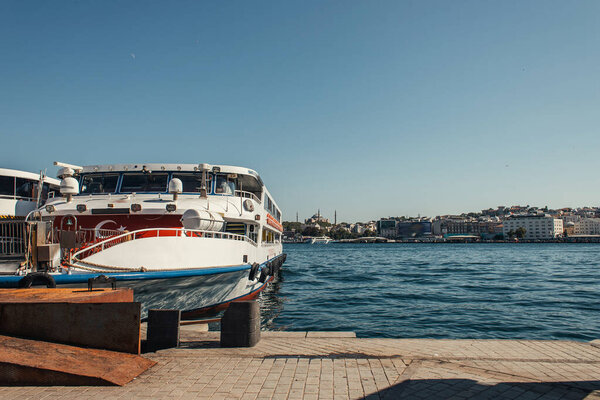 Turkish flag on ship near coast in Istanbul, Turkey 