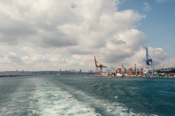 Cranes of cargo port on seafront in Istanbul, Turkey 