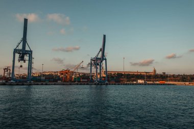 Constructions and cranes in cargo port near sea in Istanbul, Turkey  clipart