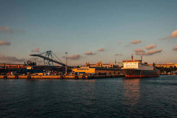 Cargo ship moored near port during sunset, Istanbul, Turkey 