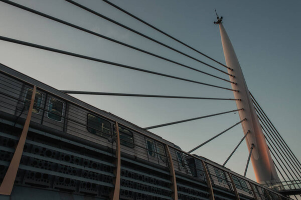 Low angle view of train and construction of Golden horn metro bridge with sky at background, Istanbul, Turkey 