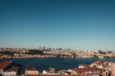 picturesque view of city and Bosphorus strait against cloudless sky, Istanbul, Turkey clipart