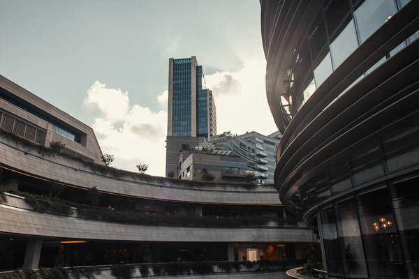 complex of contemporary buildings against cloudy sky