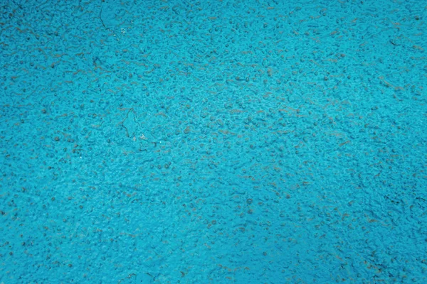 textured surface with blue, grungy plastering, top view
