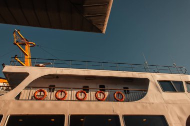 red lifebuoys on moored vessel against blue sky, Istanbul, Turkey clipart