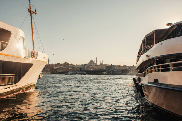 moored ships and view of city from Bosphorus strait, Istanbul, Turkey