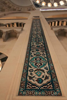 ISTANBUL, TURKEY - NOVEMBER 12, 2020: low angle view of column with ornamental tiles in Mihrimah Sultan Mosque clipart