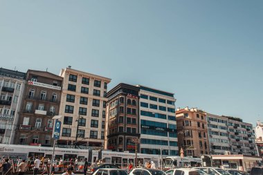 ISTANBUL, TURKEY - NOVEMBER 12, 2020: crowded street with traffic and contemporary houses in Istanbul, Turkey clipart