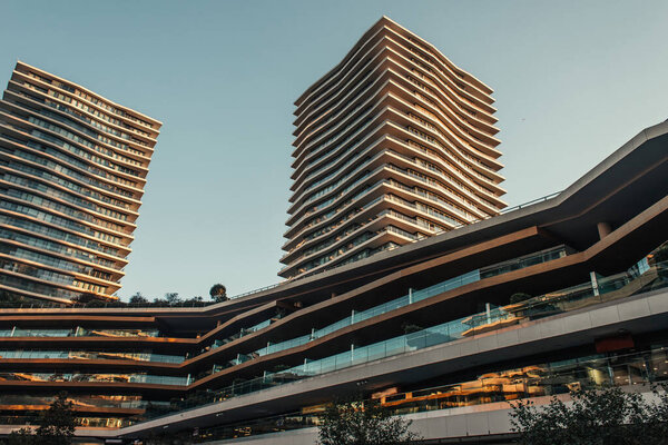 complex of modern buildings with skyscrapers against clear sky
